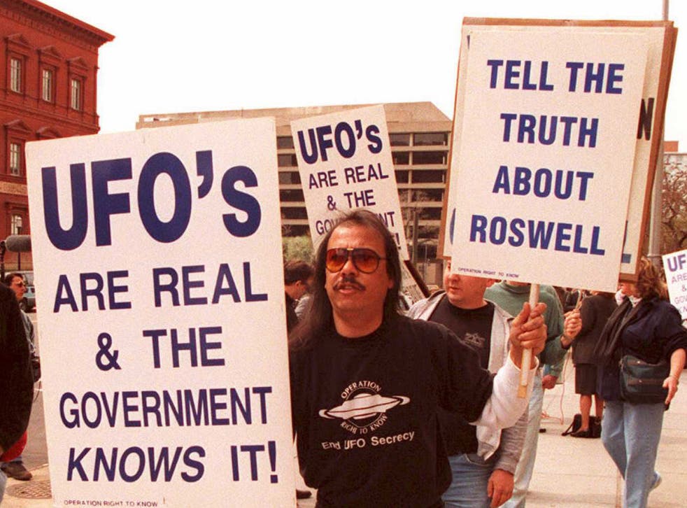 Protestors demand to know about the crash at Roswell in 1947, which they believe was a UFO
