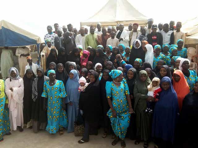 Members of the IMN pose with the congregation at the Evangelical Church Winning All (ECWA) in Kaduna