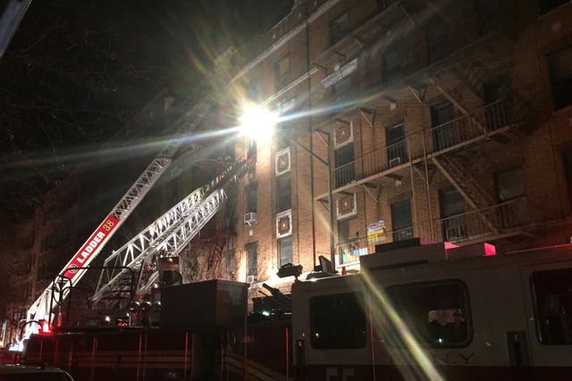New York Fire Department ladder trucks at the scene of a fire in the Bronx