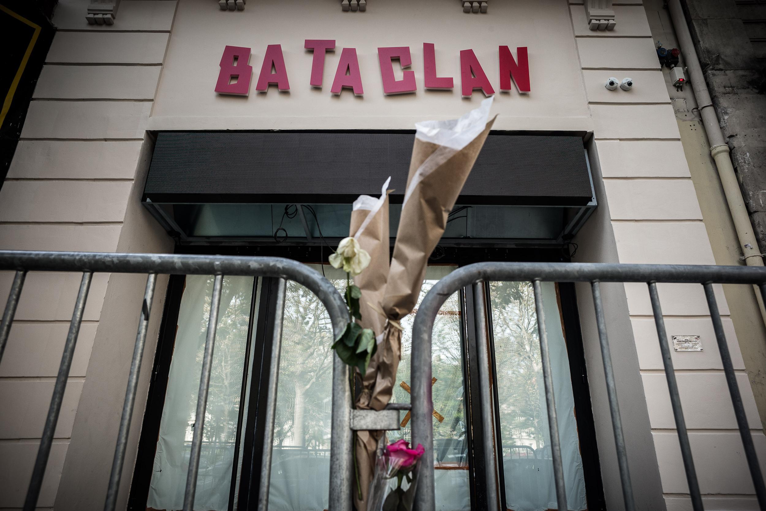 Flowers are tied to a fence outside the 'Bataclan' concert hall during All Saints' day in Paris on November 1, 2016, one of the targets of the November 13, 2015 terrorist attacks during which 130 people were killed and another 413 were wounded in the Fren
