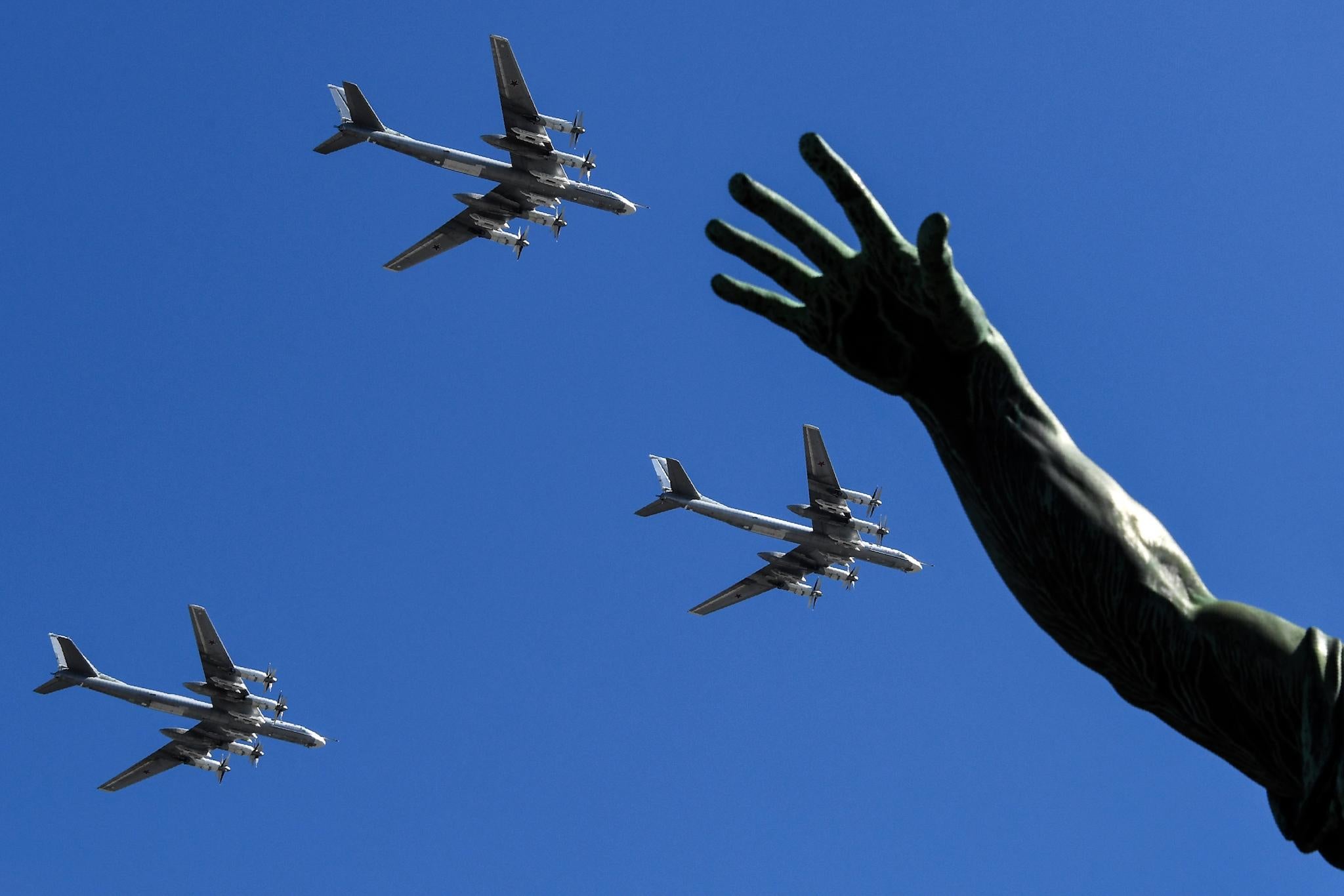 Russian Tu-95MS strategic bombers fly over Red Square during a rehearsal for the Victory Day military parade in Moscow