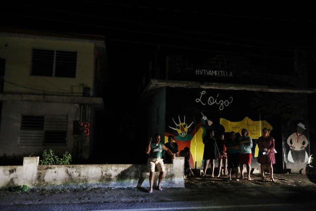 Christmas revellers gather on December 25 in Loiza, Puerto Rico