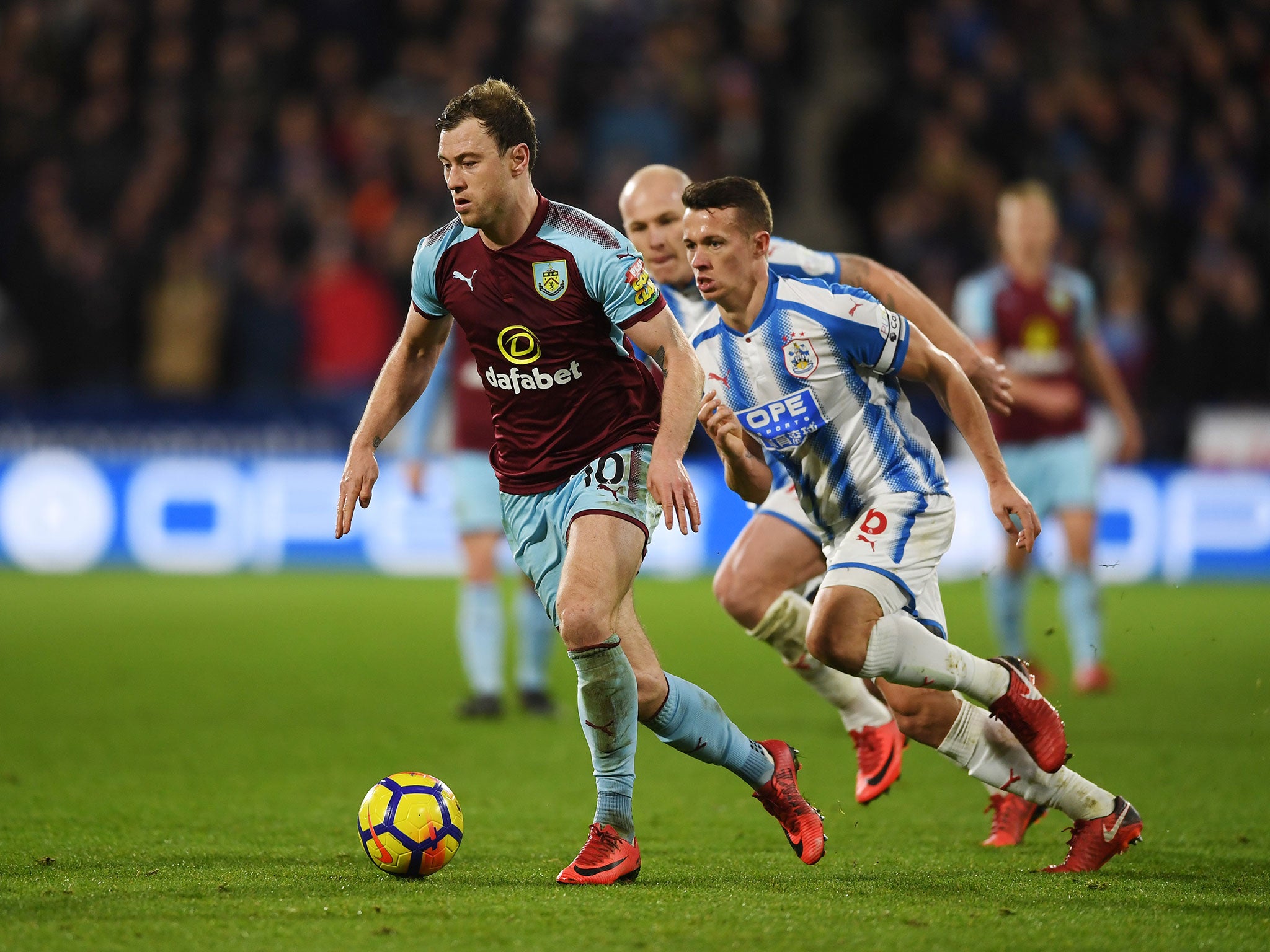 Ashley Barnes looks to get away from Jonathan Hogg