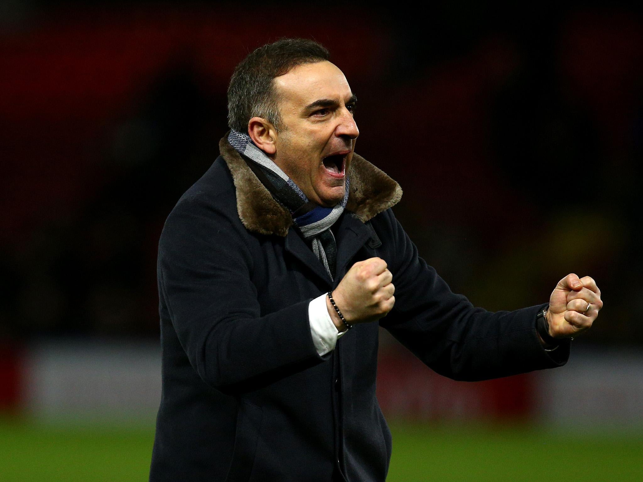 Carlos Carvalhal celebrates after the final whistle at Vicarage Road