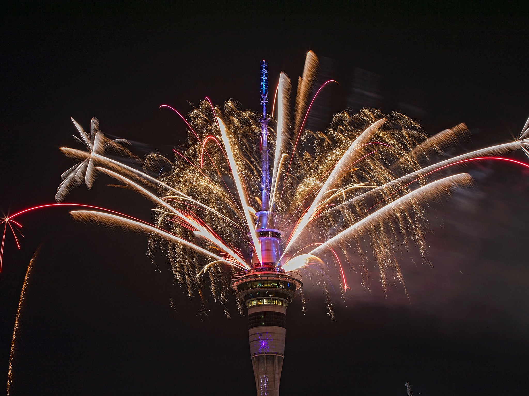 Over 5 minutes of fireworks from the Sky Tower welcomes in the new year in Auckland, New Zealand