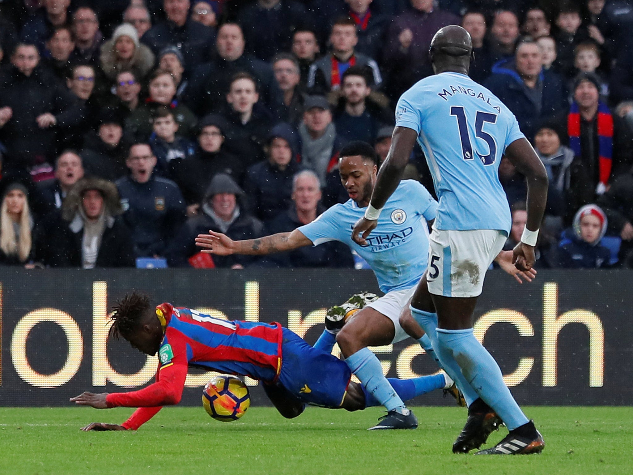 Wilfriez Zaha won a penalty when he was brought down by Raheem Sterling