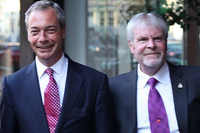 Stephen Searle, who served as a Ukip county councillor for four years, with Nigel Farage in 2013
