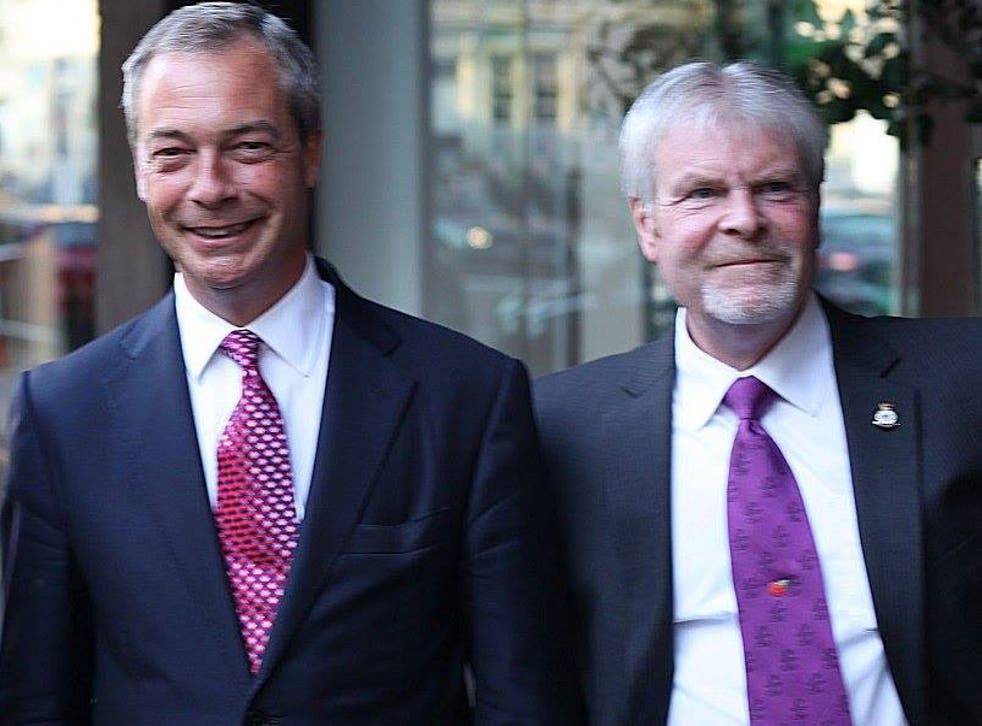 Stephen Searle, who served as a Ukip county councillor for four years, with Nigel Farage in 2013