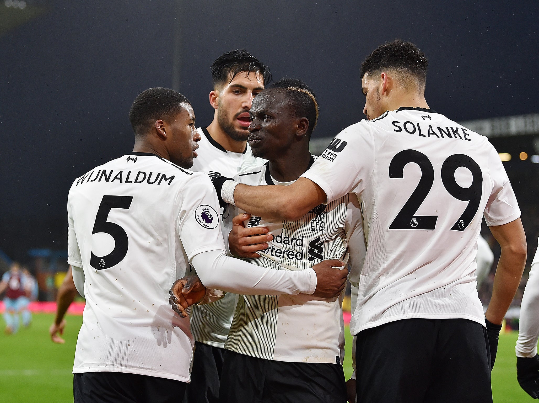 Mane is mobbed by his team-mates after breaking the deadlock