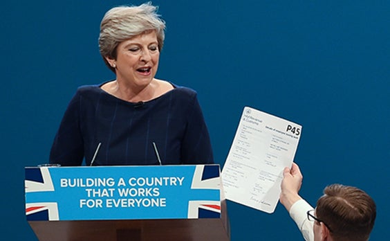 Brodkin hands Theresa May a fake P45, on stage in Manchester last year