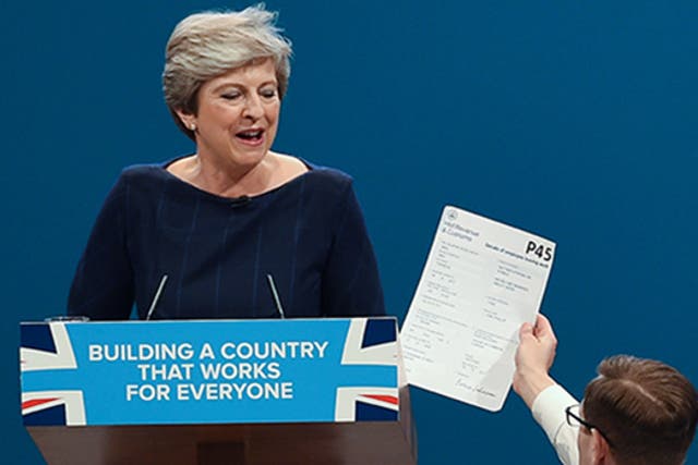 Brodkin hands Theresa May a fake P45, on stage in Manchester last year 