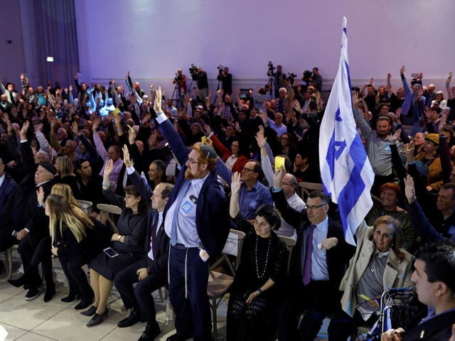 Likud party members vote during a Likud Central Committee meeting in Airport City, Israel December 31, 2017