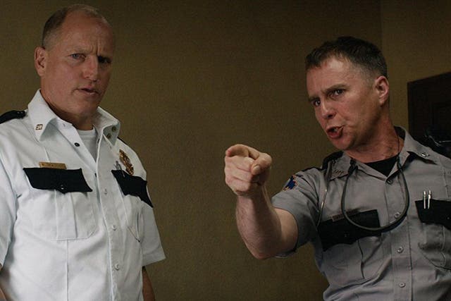 Officer Jason Dixon (right), played by Sam Rockwell, has stirred frenzied debate online