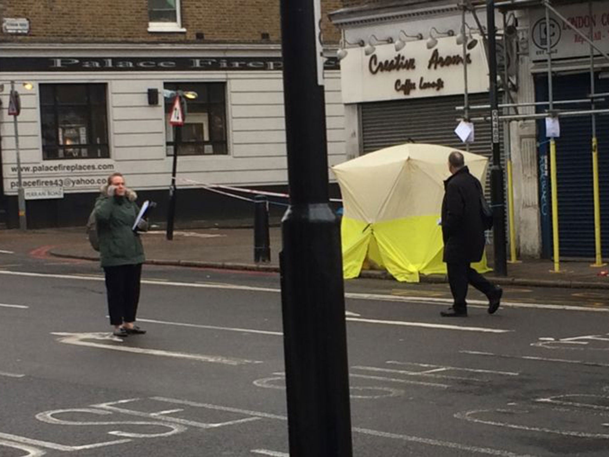 Police officers in Tulse Hill, south London, after a 17-year-old boy was stabbed to death