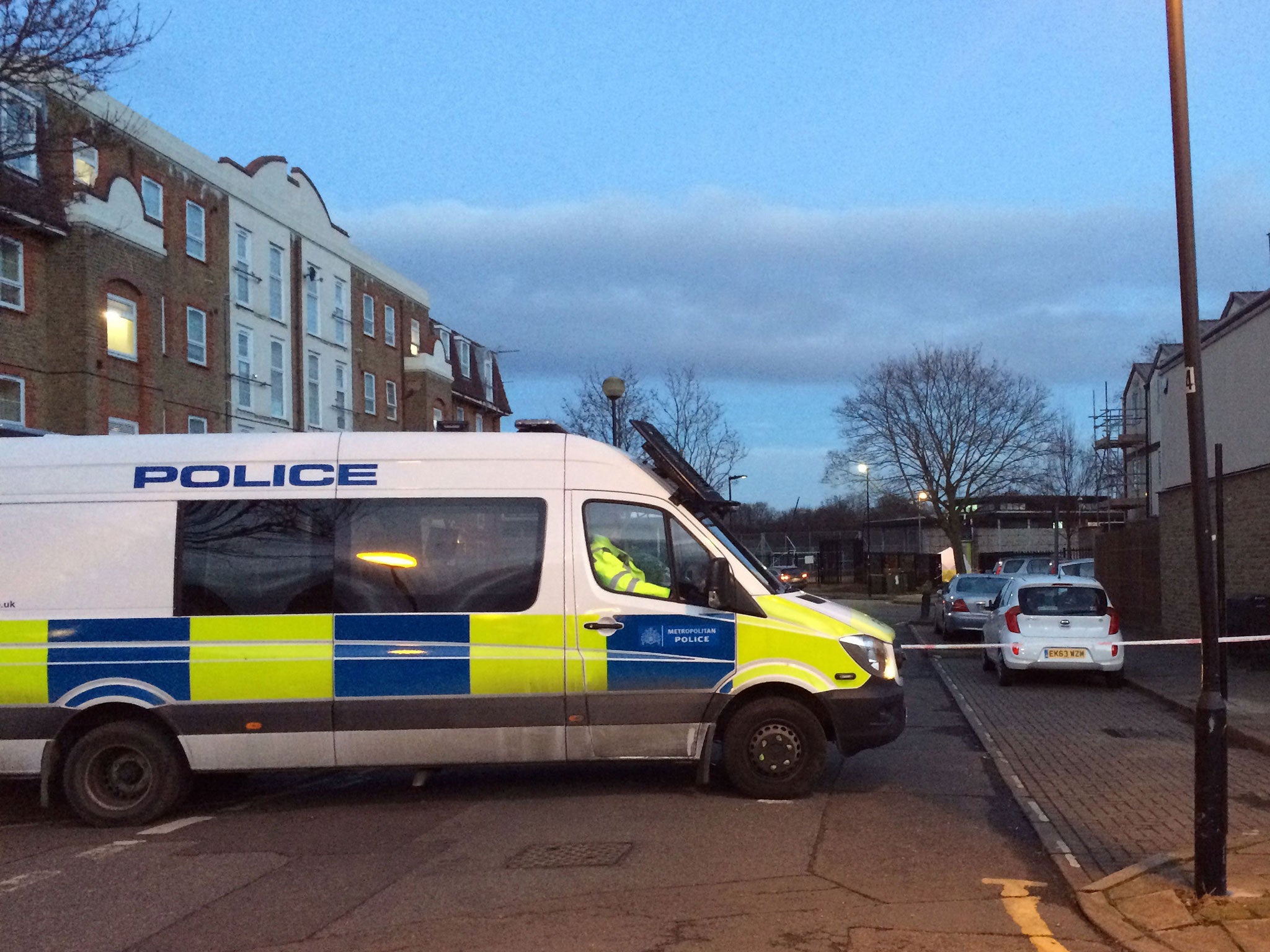 A police van on Memorial Avenue in West Ham, east London, near to the scene of a stabbing.