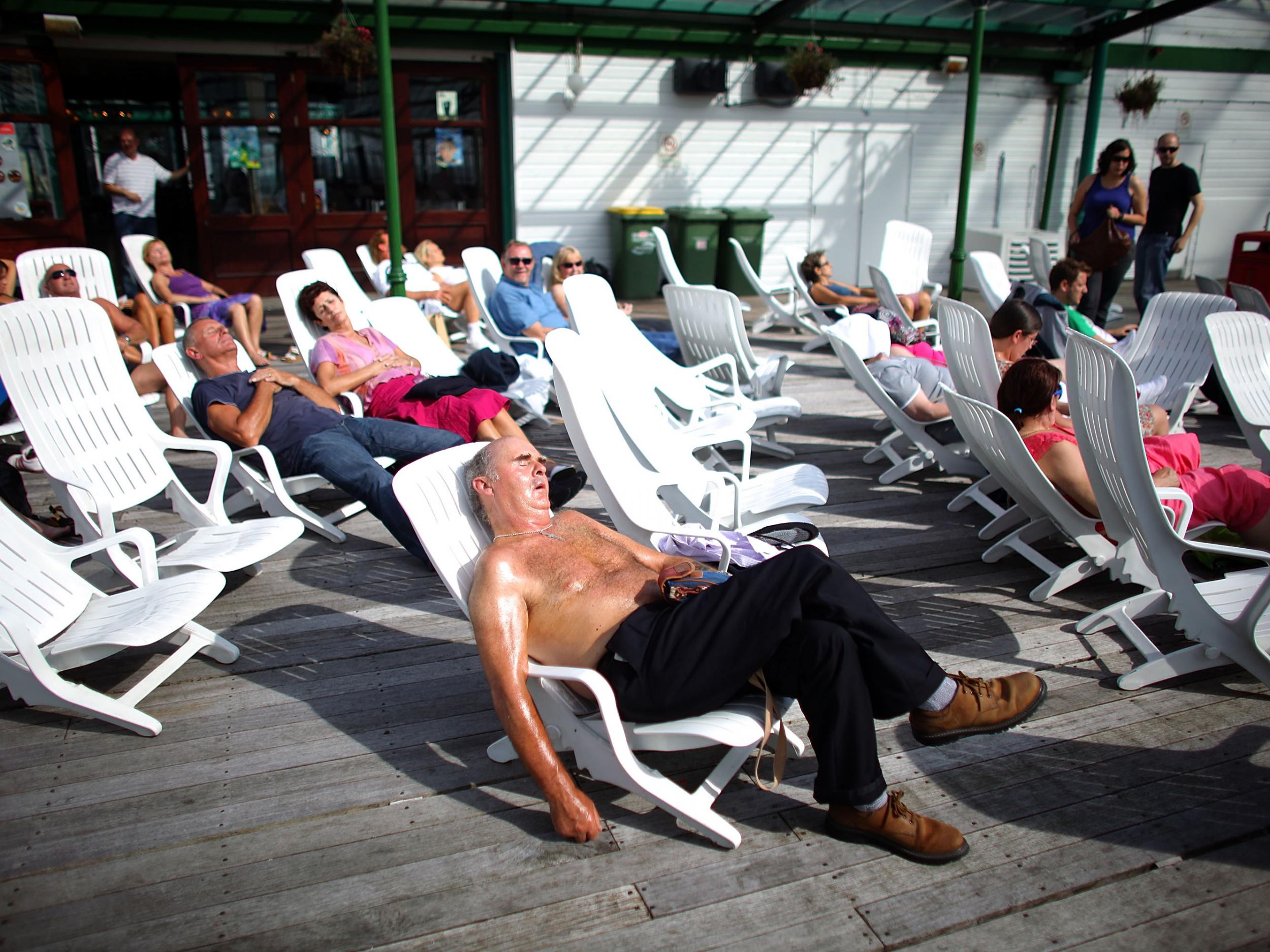 Holidaymakers enjoy a traditional day at the seaside as in Britain's favourite seaside resort: Blackpool