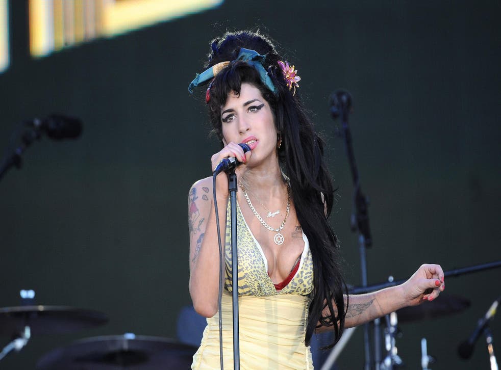 Amy Winehouse performs on stage during Rock in Rio Day 3 on July 04, 2008 near Madrid in Arganda del Rey, Spain. Credit: Carlos Alvarez/Getty Images.