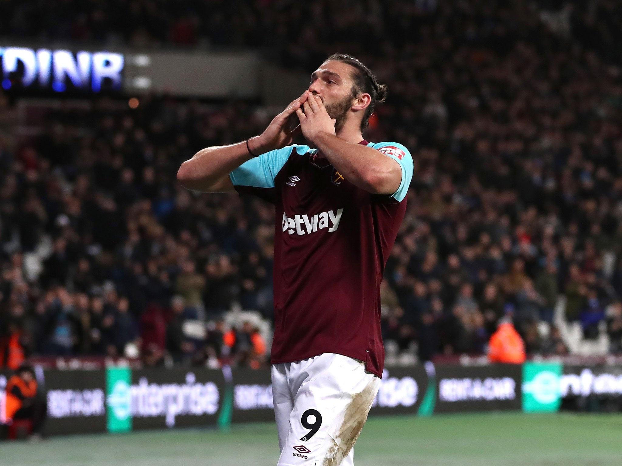 Andy Carroll celebrates after heading home an equaliser for the hosts