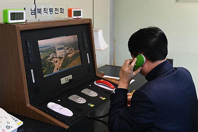 A South Korean government official checks the direct communications hotline to talk with the North Korean side at the border village of Panmunjom