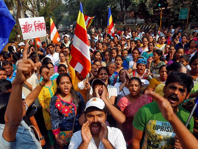 Members of the Dalit community shout slogans as they block a road during a protest in Mumbai on 3 January