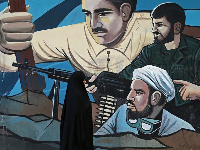 A mural in Tehran depicts members of the Basij – a force of several million volunteers