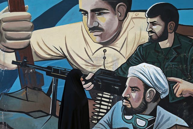 A mural in Tehran depicts members of the Basij – a force of several million volunteers