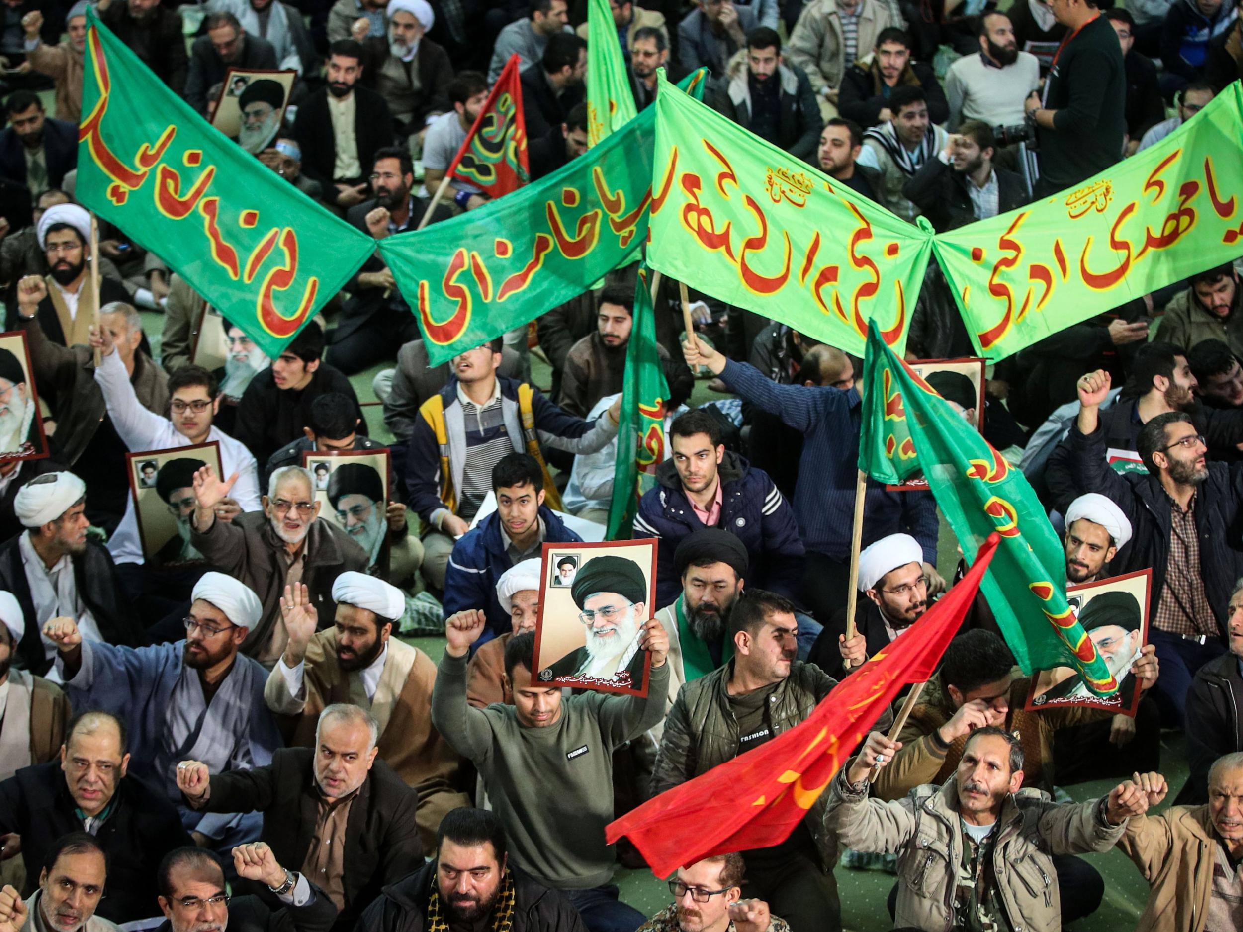 Iranians march in support of the government in Tehran on 30 December