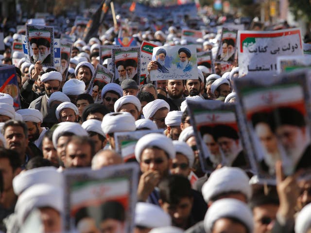 Iranian clerics take part in a state-organised rally against anti-government protests in the city of Qom, in south-west Iran