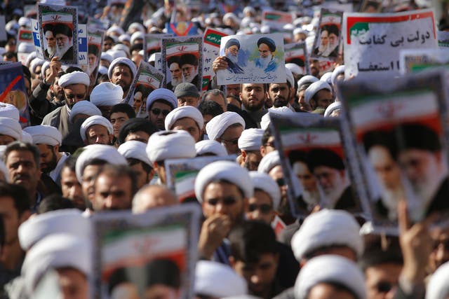 Iranian clerics take part in a state-organised rally against anti-government protests in the city of Qom, in south-west Iran