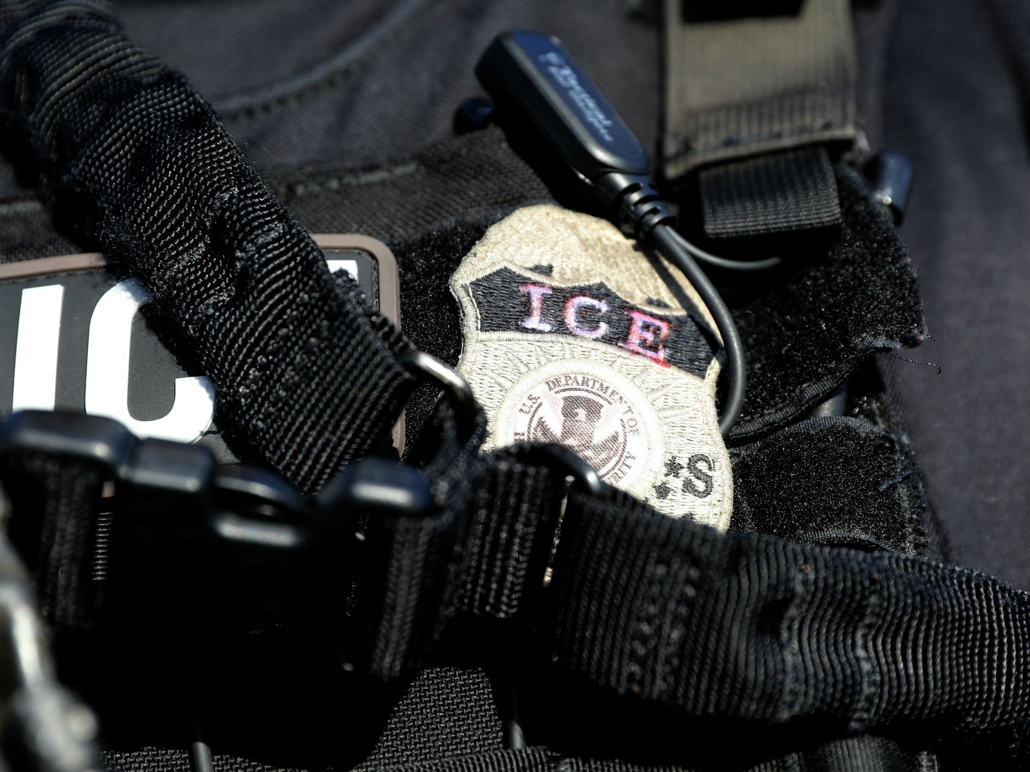 The badge of a US Immigration and Customs Enforcement agent is seen in Santa Ana, California