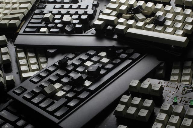 Broken computer keyboards are seen in this illustration picture taken in Warsaw, December 13, 2013