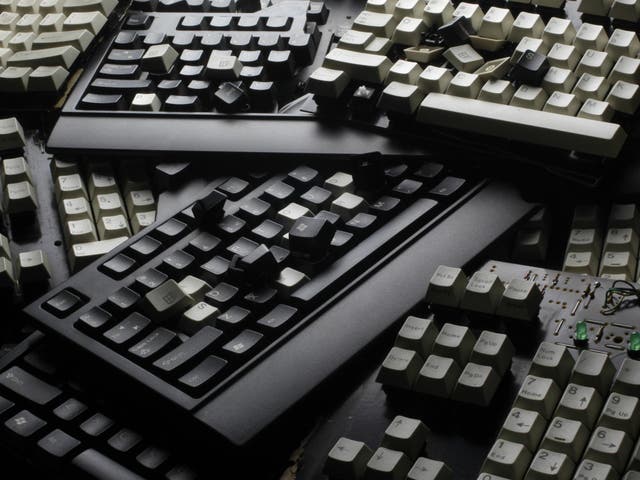 Broken computer keyboards are seen in this illustration picture taken in Warsaw, December 13, 2013