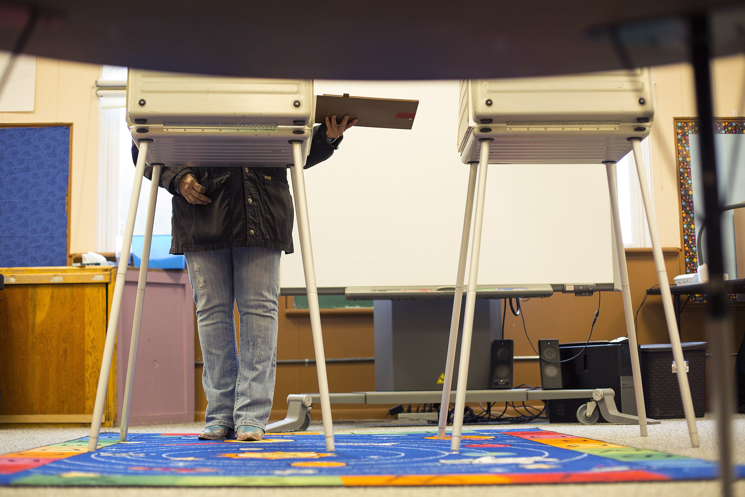 A voter casts a ballot in a different US election