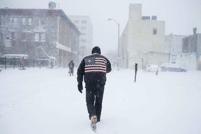 A man pushes his way through the snowstorm in Atlantic City, New Jersey