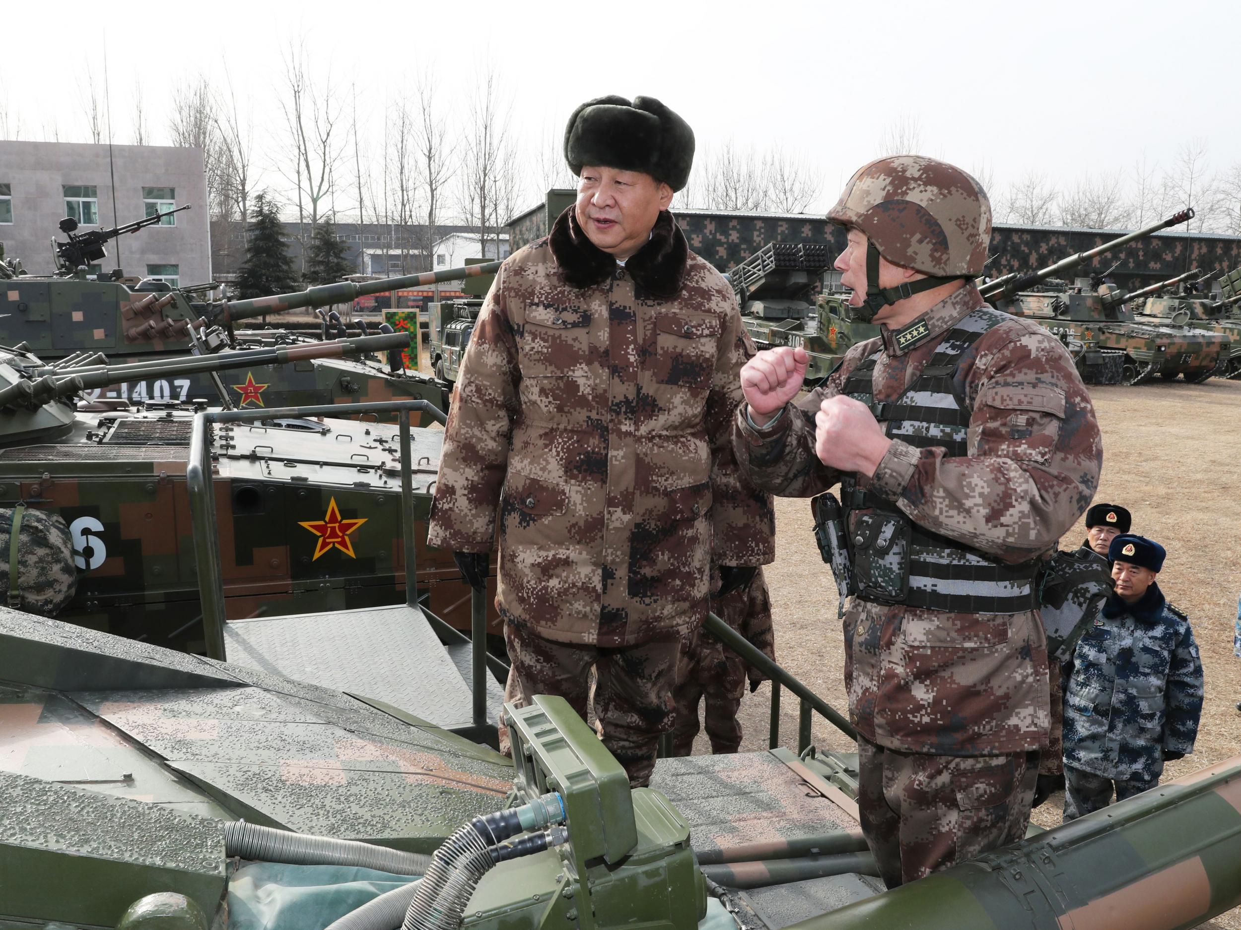 Xi Jinping (left) inspecting tanks ahead of the military parade in Heibei