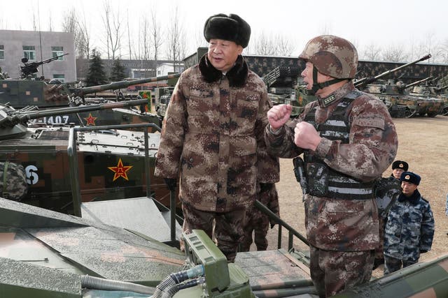 Xi Jinping (left) inspecting tanks ahead of the military parade in Heibei