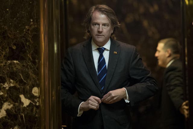Mr McGahn is pictured here leaving the White House during the presidential transition period in 2016