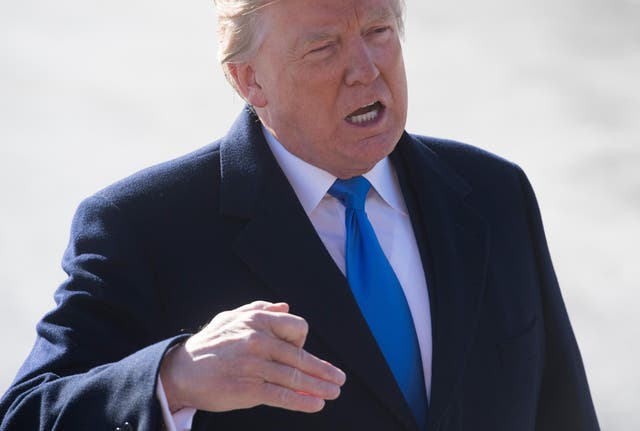 Donald Trump speaks to the media as he walks to Marine One