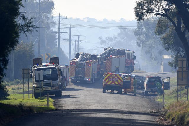 Fire Authority officers in Melbourne a fire rages amid an extreme heatwave