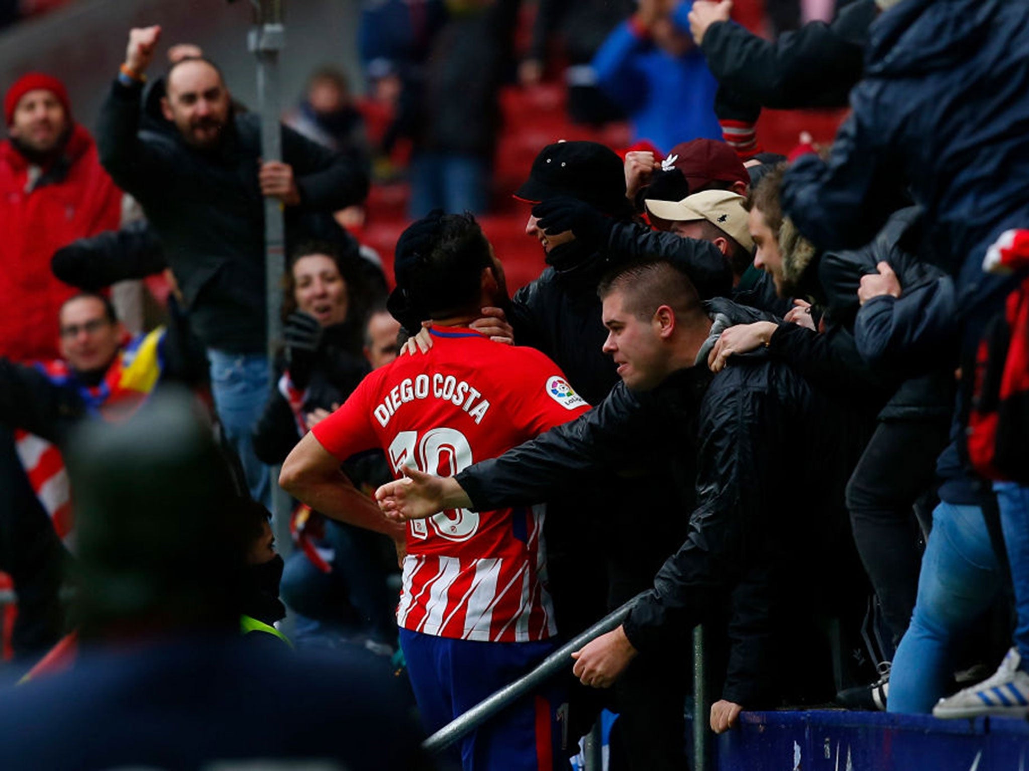 &#13;
Costa is embraced by Atleti fans after scoring on his return. (Getty )&#13;