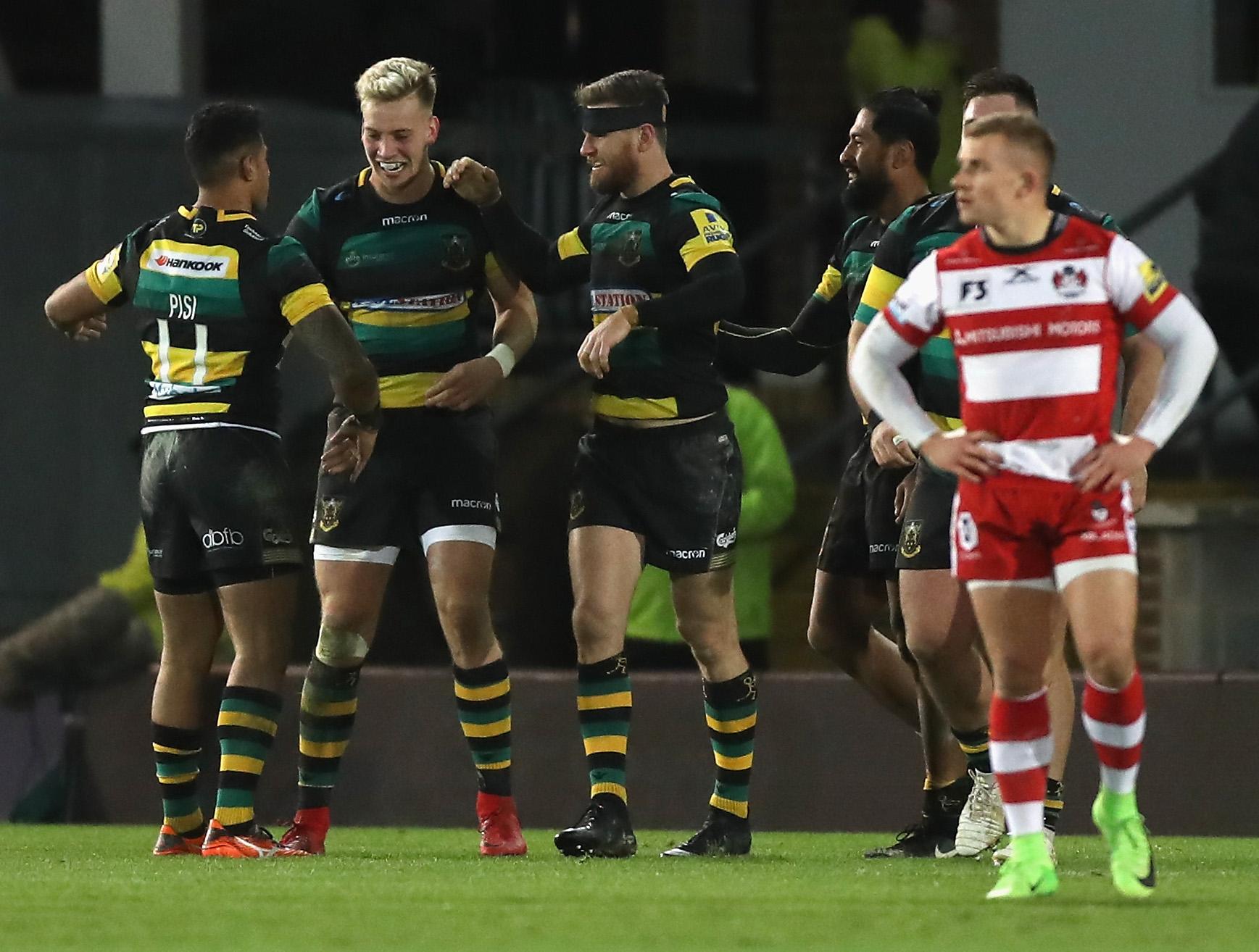 Northampton Saints players celebrate their late penalty try