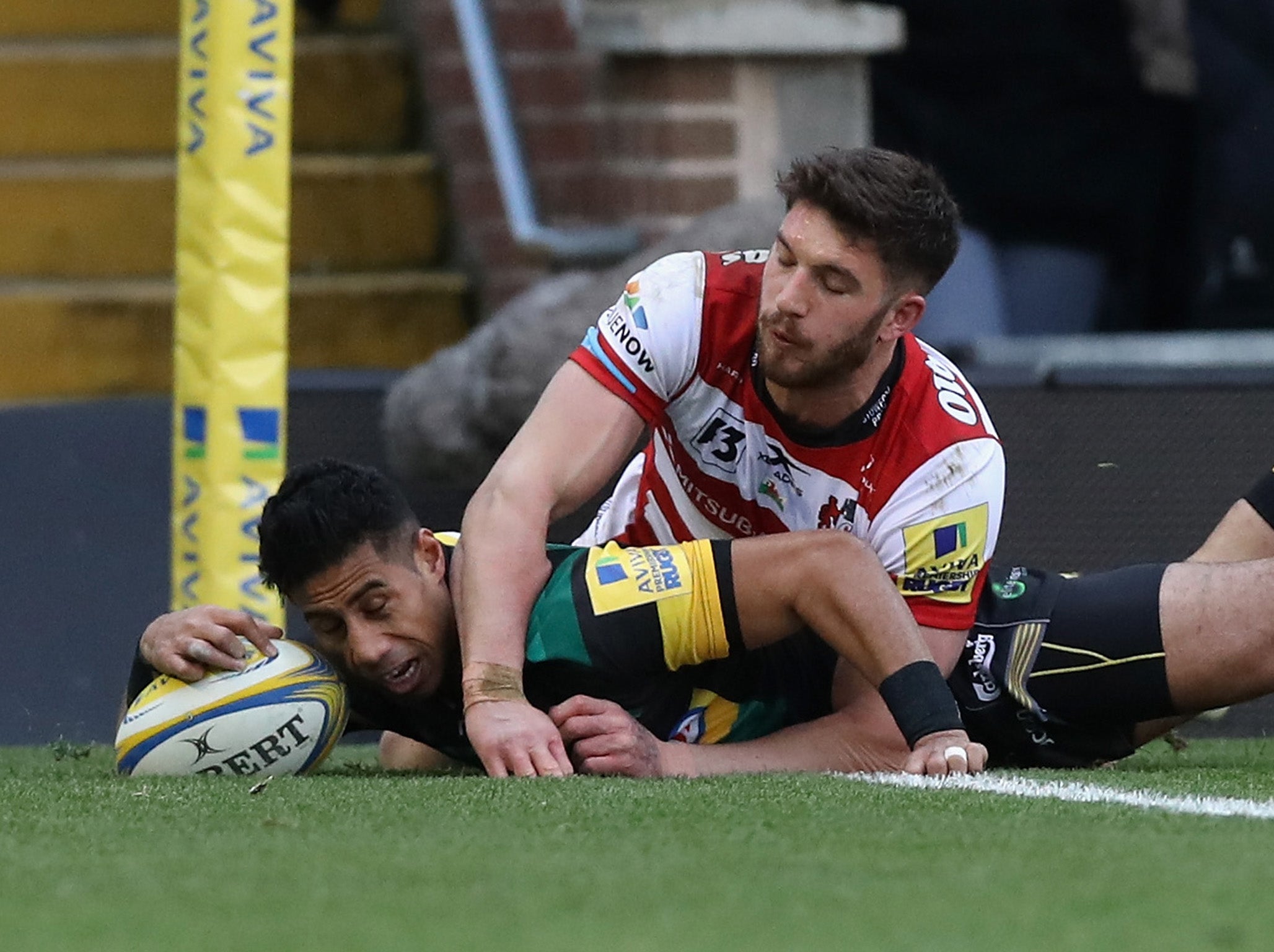 Ken Pisi dives over for Northampton's opening try