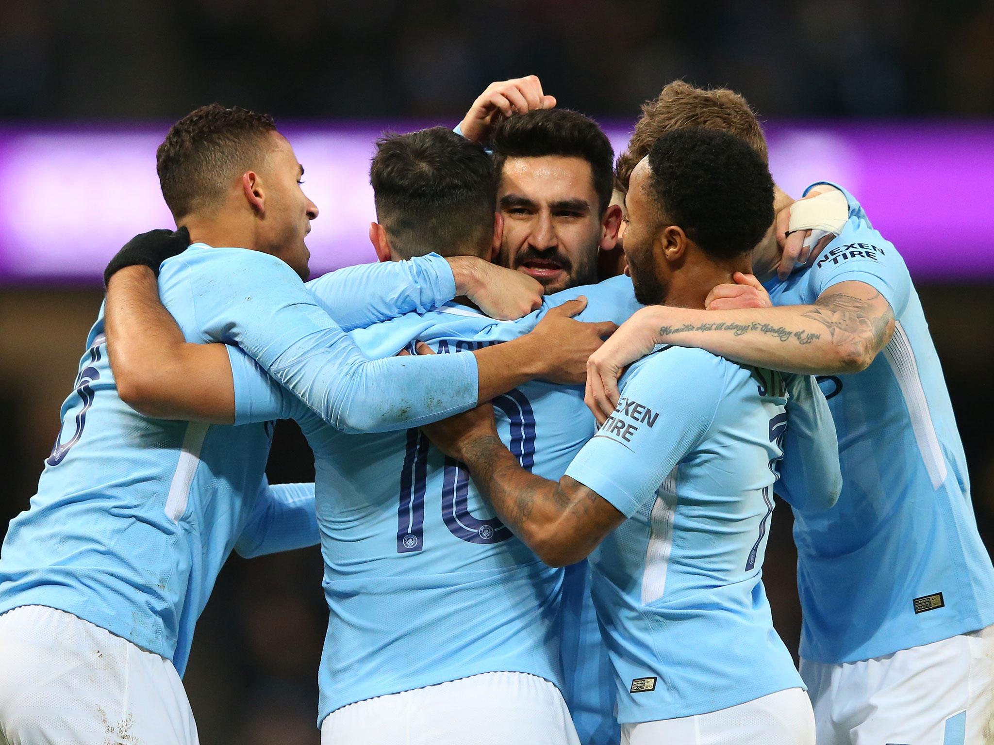 Manchester City's celebrate together after drawing level with Burnley on Saturday