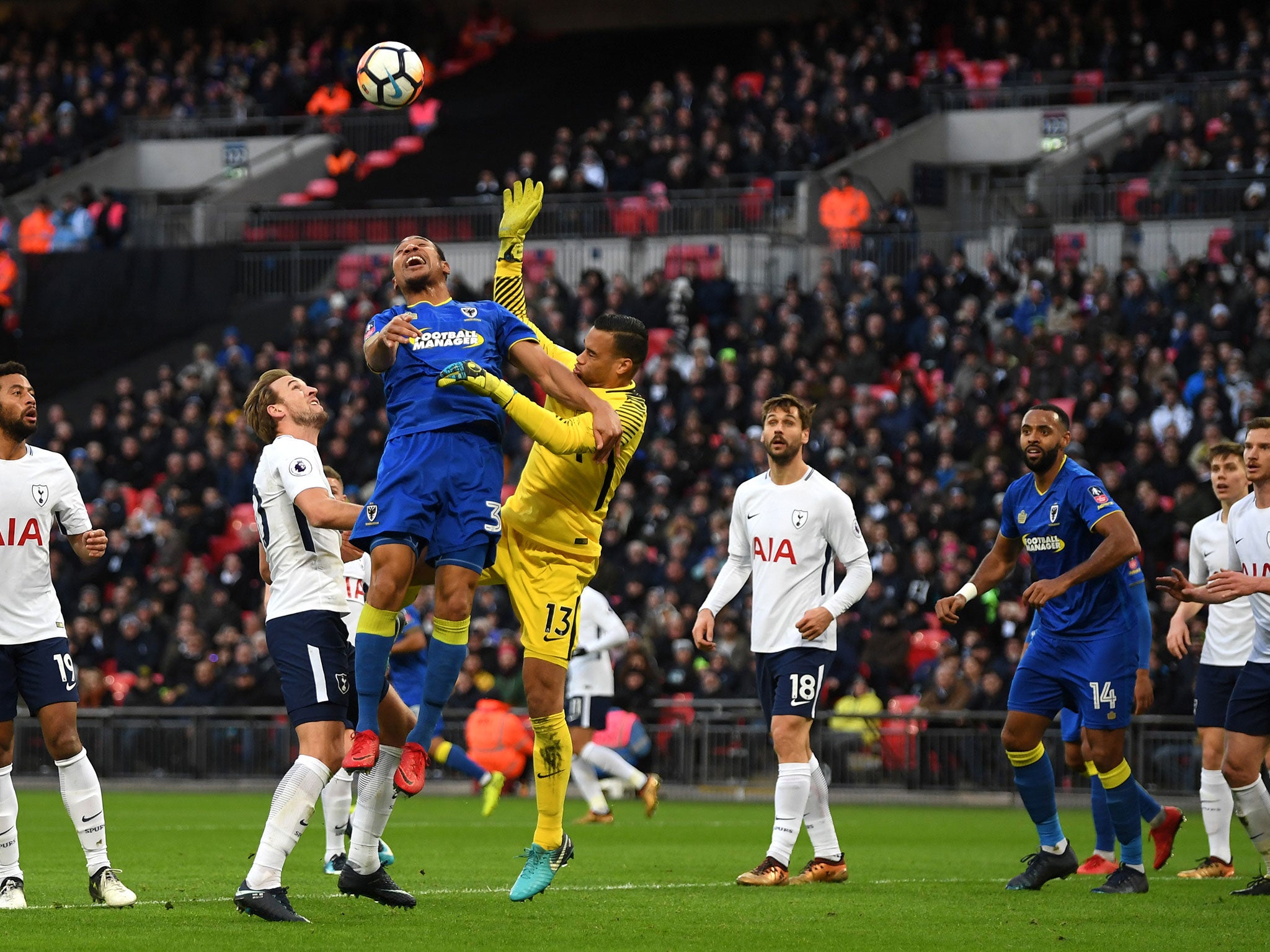 Darius Charles and Michel Vorm challenge for a high ball