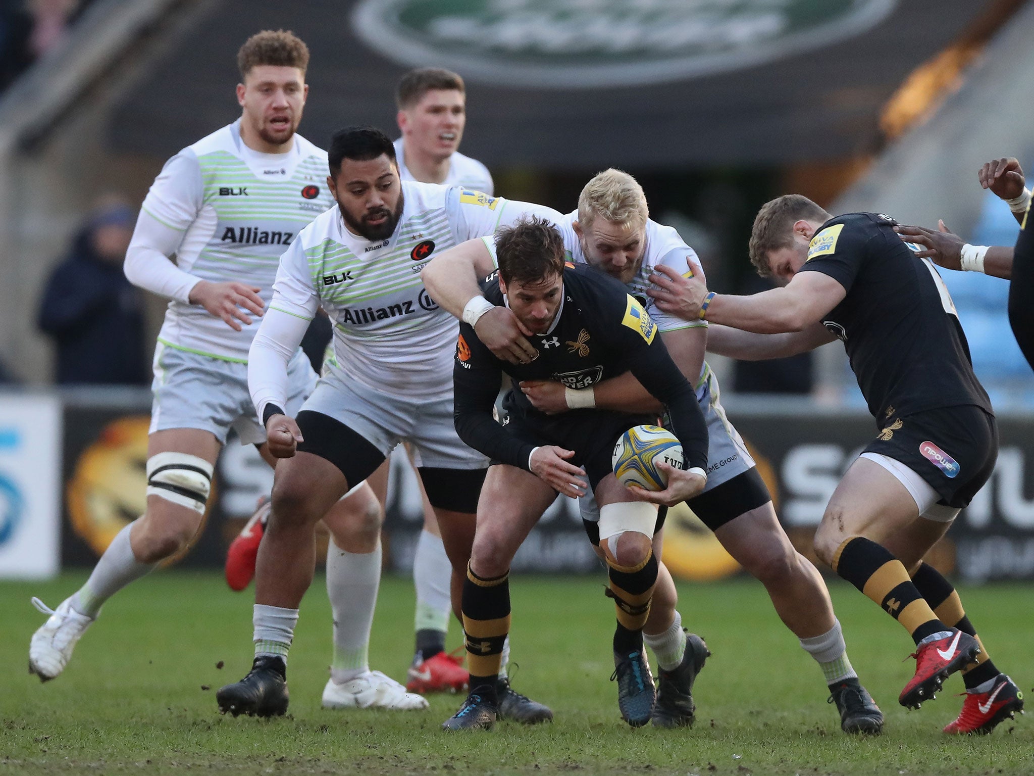 Danny Cipriani is tackled by Vincent Koch