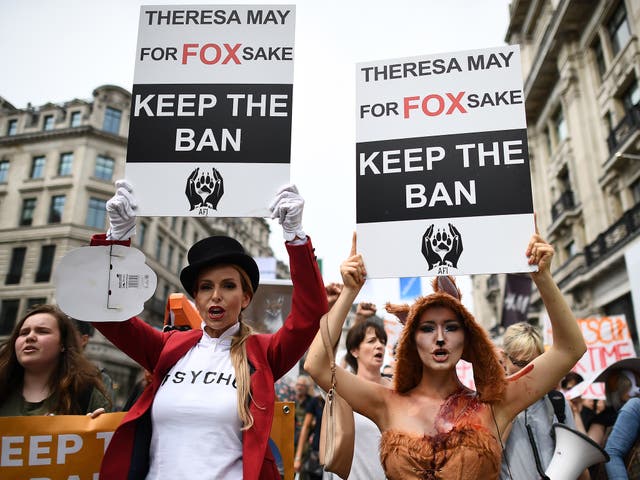 <p>Anti fox hunting protesters march through the streets of London on 29 May 2017</p>