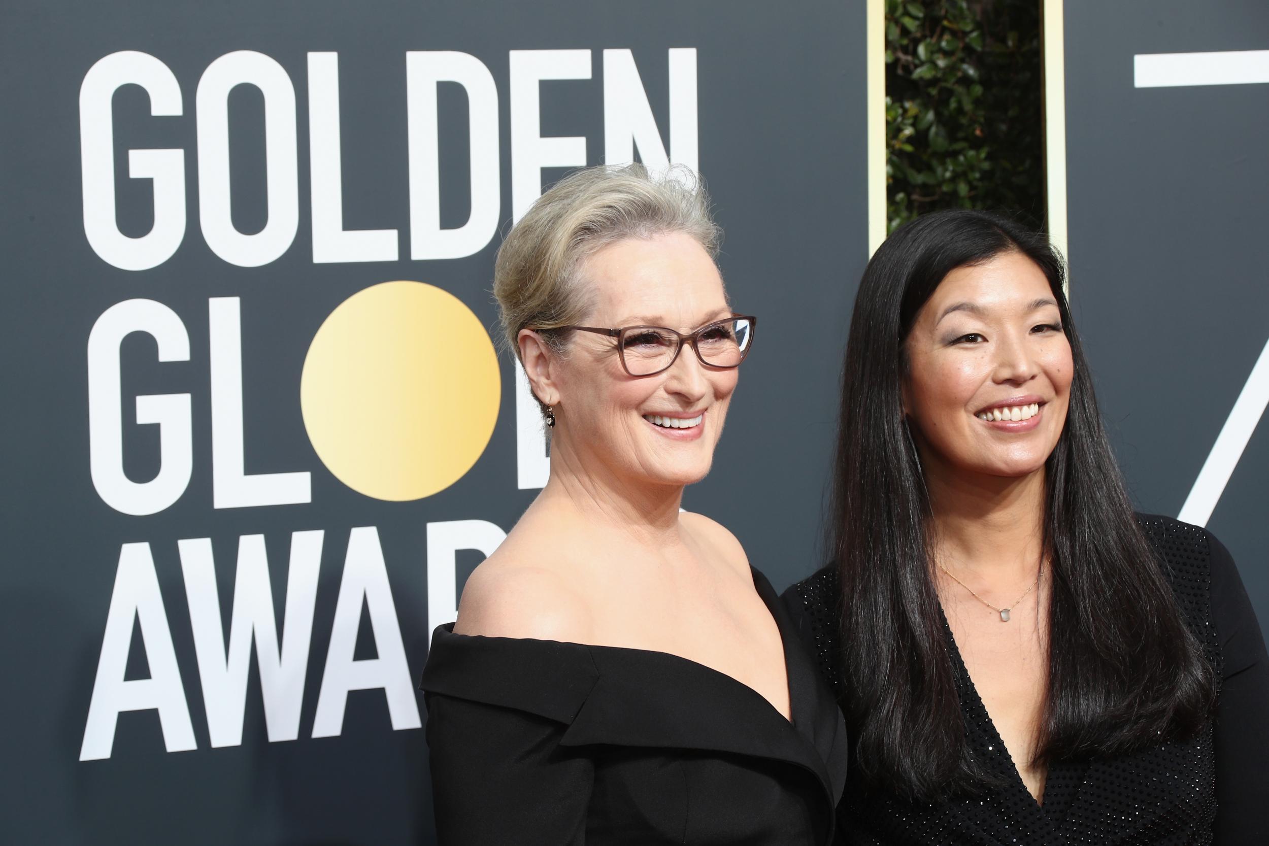 Meryl Streep (L) and Ai-jen Poo attends The 75th Annual Golden Globe Awards at The Beverly Hilton Hotel on January 7, 2018 in Beverly Hills, California. Credit: Frederick M. Brown/Getty Images.