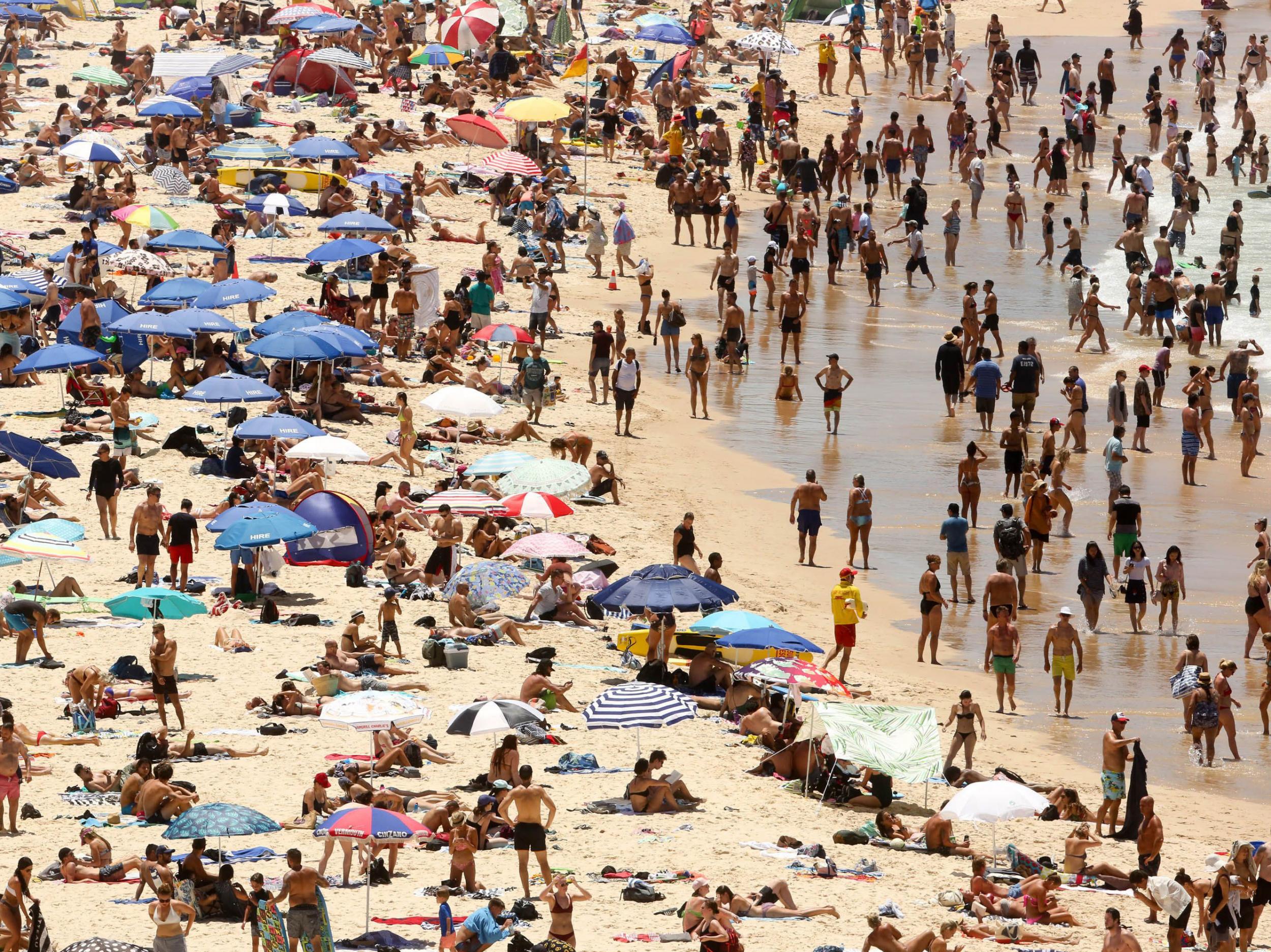 People crowd the beach on Bondi beach in Sydney, Australia