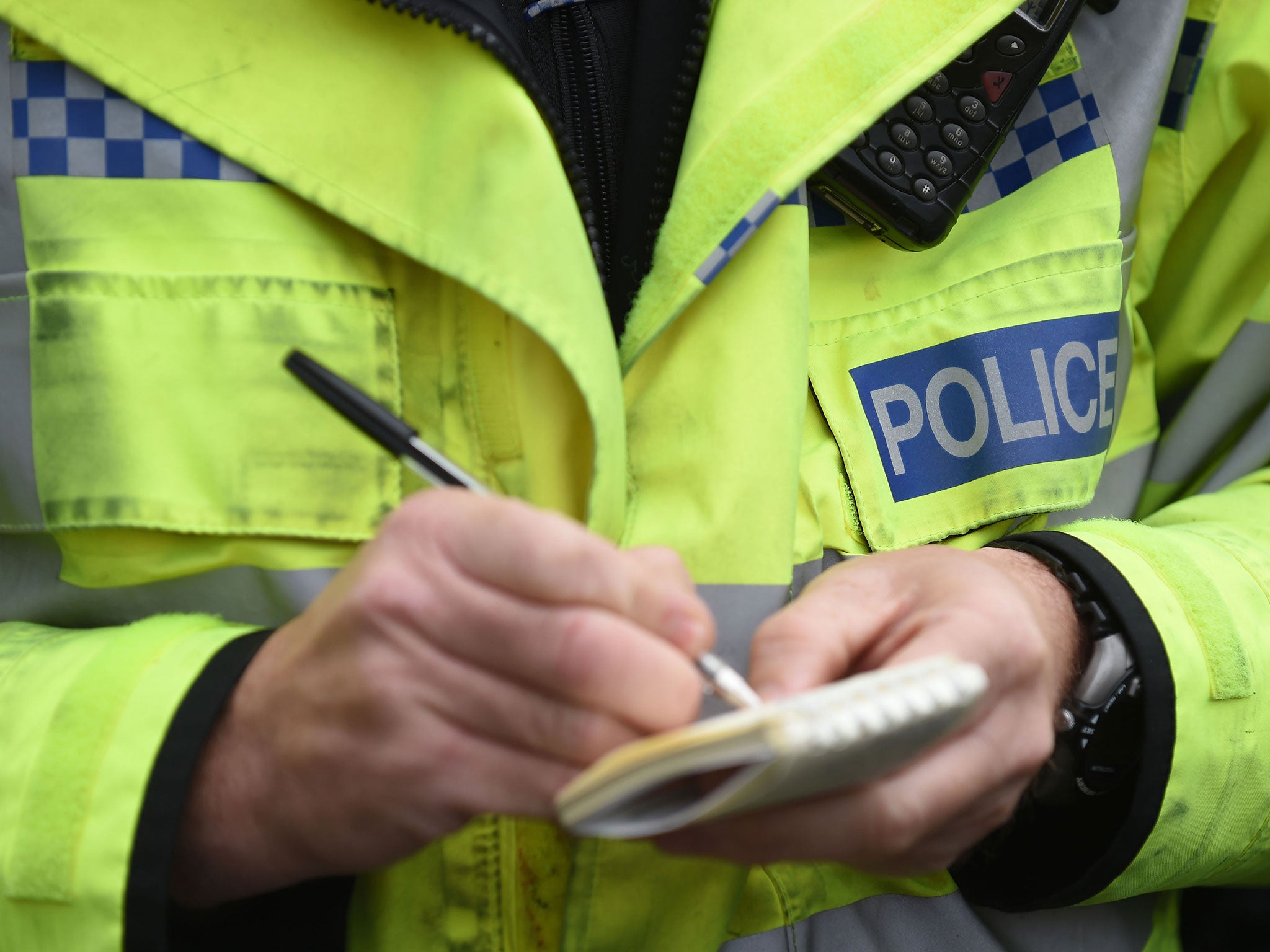 File photo of police officer with notebook