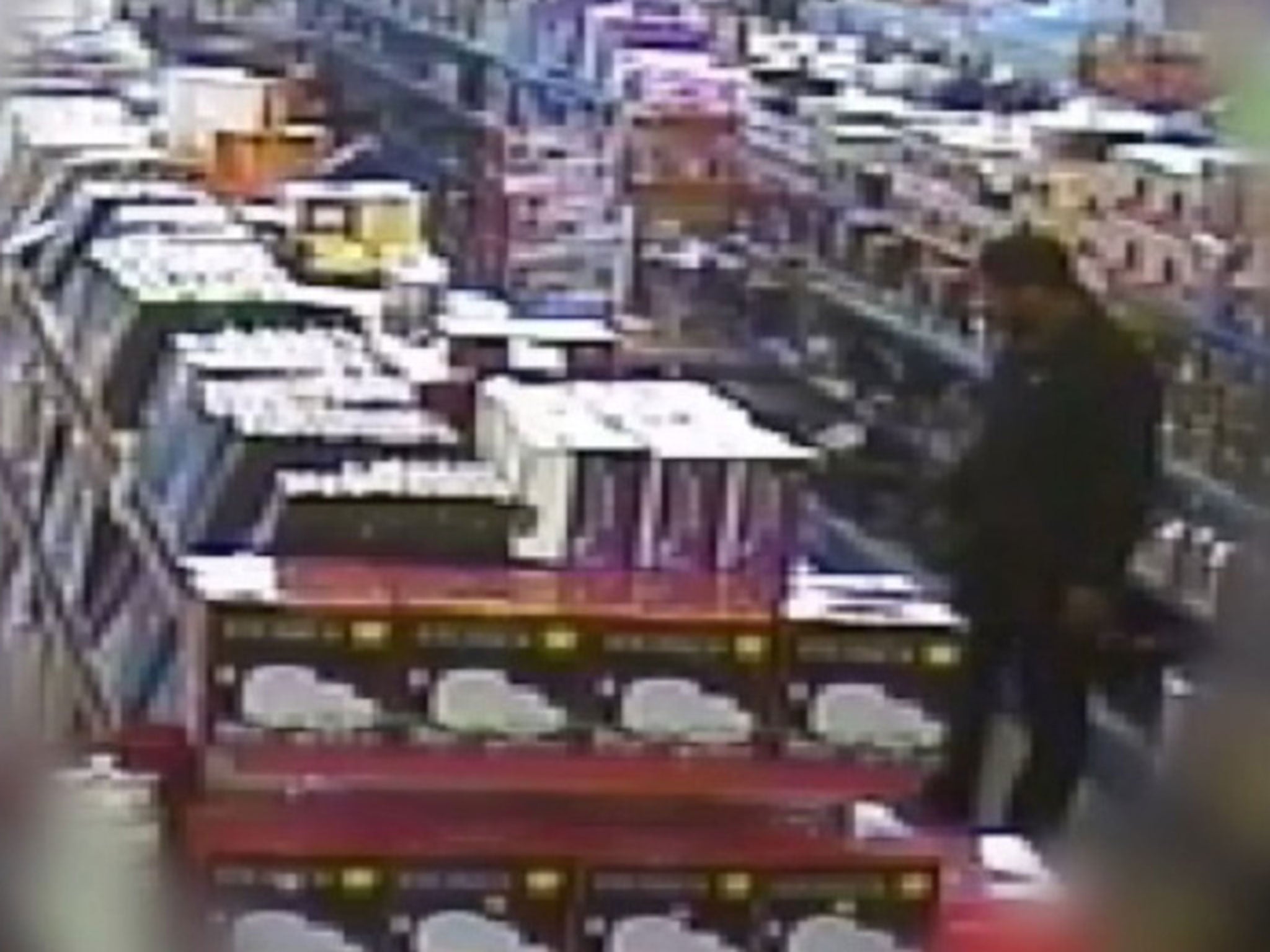Munir Mohammed looking at pressure cookers at a shop in Derby, during the time he was attempting to build a bomb